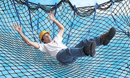 Technician installing a safety net on a Mumbai balcony